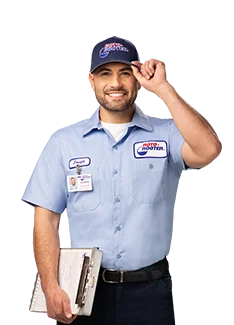 Roto-Rooter technician tipping hat holding clipboard