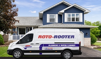 A Root-Rooter van with a technician ready to do a faucet repair in Dallas