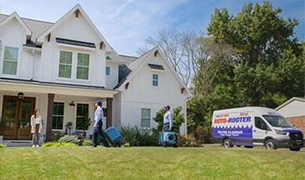 A Roto-Rooter technician doing a leak repair in Dallas.