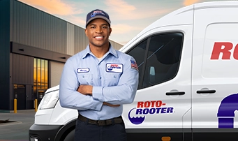 Plumber and service van pictured prior to a commercial job