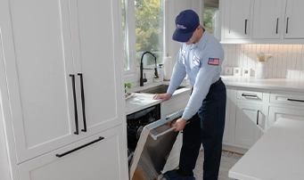 Roto-Rooter technician completes a dishwasher installation in Portland
