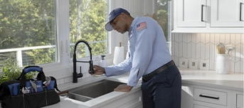 Roto-Rooter technician performs faucet repair in Portland