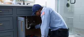 Roto-Rooter technician performs a bathroom sink leak repair in Portland