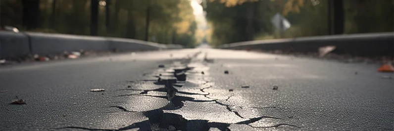 Cracks in the middle of a paved road