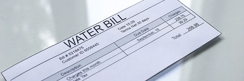 Water bill sitting on a kitchen counter