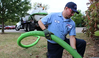 Roto-Rooter Plumber cleaning up backed up sewer