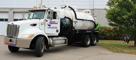Roto-Rooter Plumbing Truck harboring drainage input from technician