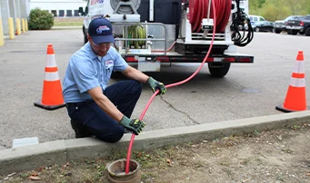 Roto-Rooter plumber cleaning up sewage